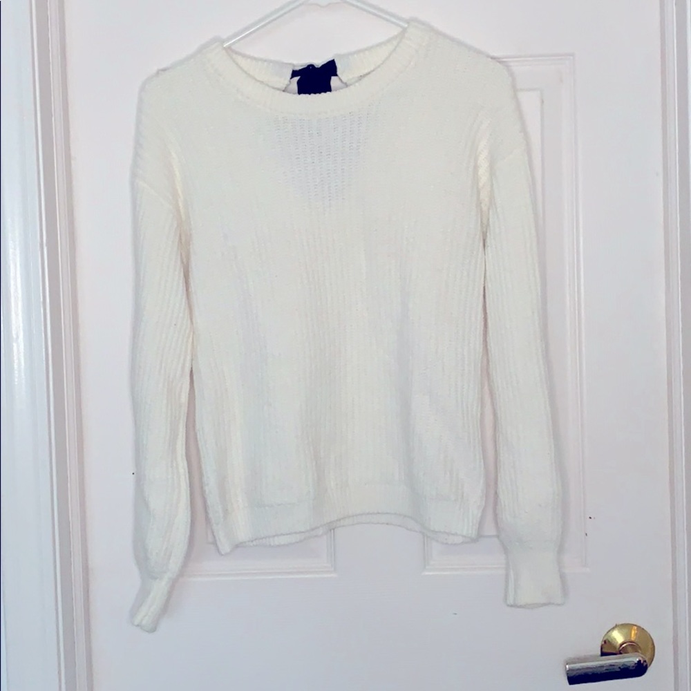 White sweater with black bow